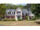 Charming two-story home with red shutters, brick accents and meticulously landscaped front yard at 250 Clearview Cir, Mcdonough, GA 30253