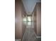 Hallway with neutral carpet leading to other rooms, showcasing the home's layout at 250 Clearview Cir, Mcdonough, GA 30253