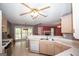Bright kitchen featuring a white countertop, stainless steel sink and appliances, and wooden cabinetry at 250 Clearview Cir, Mcdonough, GA 30253