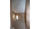 Landing area with light brown carpet and a white wooden railing overlooking the staircase at 250 Clearview Cir, Mcdonough, GA 30253