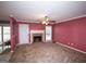 Cozy living room features a fireplace, carpet flooring, and neutral paint colors for a warm and inviting atmosphere at 250 Clearview Cir, Mcdonough, GA 30253
