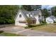A charming two-story house with an attached garage, showcasing well-maintained landscaping and a spacious driveway at 250 Clearview Cir, Mcdonough, GA 30253