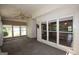 Spacious sunroom featuring large windows and a ceiling fan, perfect for relaxation at 250 Clearview Cir, Mcdonough, GA 30253
