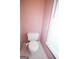 Powder room featuring a white toilet and a window at 250 Clearview Cir, Mcdonough, GA 30253