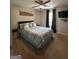 Bedroom featuring a queen bed, carpet, ceiling fan, and mounted television at 6070 Ridge Way, Douglasville, GA 30135
