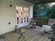 Relaxing patio complete with a pair of lounge chairs and french doors at 6070 Ridge Way, Douglasville, GA 30135