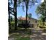 View of house with driveway, two-car garage, wooden steps, siding, and roof at 6070 Ridge Way, Douglasville, GA 30135