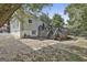 The backyard shows a brick patio, upper deck, and mature trees at 1449 Wadley Ave, East Point, GA 30344
