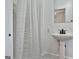 Bathroom featuring a shower, and a pedestal sink at 1449 Wadley Ave, East Point, GA 30344