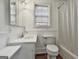 Bathroom features a sink, toilet, and tub at 1449 Wadley Ave, East Point, GA 30344