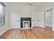 Bright bedroom featuring a fireplace, and two closets at 1449 Wadley Ave, East Point, GA 30344