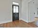 Entryway featuring hardwood flooring, doorway, and vintage door at 1449 Wadley Ave, East Point, GA 30344