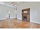 Bright living room features hardwood floors and a decorative fireplace at 1449 Wadley Ave, East Point, GA 30344