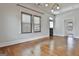 Bright living room features hardwood floors and view of the entryway at 1449 Wadley Ave, East Point, GA 30344