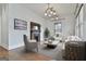 Cozy living room features a fireplace, modern lighting and stylish decor at 1449 Wadley Ave, East Point, GA 30344