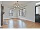 Bright living room features hardwood floors and a decorative fireplace near the entrance at 1449 Wadley Ave, East Point, GA 30344