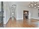Living room boasts hardwood floors, fireplace and modern lighting at 1449 Wadley Ave, East Point, GA 30344