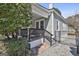 Side view of the porch with comfortable seating and privacy fencing at 1449 Wadley Ave, East Point, GA 30344