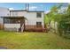 A lawn of grass and patios offer outdoor living space to the home at 2049 Charter Ln, Lithonia, GA 30058
