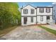 Two story townhome with driveway and lawn at 2049 Charter Ln, Lithonia, GA 30058