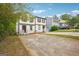 Exterior view of townhome with driveway and partial lawn at 2049 Charter Ln, Lithonia, GA 30058