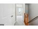 Hallway featuring carpet and wooden handrails at 2049 Charter Ln, Lithonia, GA 30058