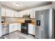 Cozy kitchen featuring stainless steel appliances and wood countertops at 2049 Charter Ln, Lithonia, GA 30058