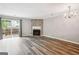 Living room with fireplace and sliding doors to outdoor space at 2049 Charter Ln, Lithonia, GA 30058