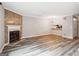 Living room featuring a fireplace and view into the kitchen at 2049 Charter Ln, Lithonia, GA 30058