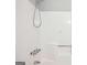 Shower stall featuring white walls, chrome fixtures, and a built-in seat for added convenience at 2049 Charter Ln, Lithonia, GA 30058