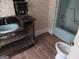 Classic bathroom features a vintage vanity and a blue tiled bathtub, offering a unique design aesthetic at 526 Mount Carmel Church Rd, Temple, GA 30179