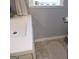 Bathroom with a neutral vanity with granite counter, framed window, and neutral tiling at 526 Mount Carmel Church Rd, Temple, GA 30179