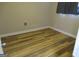 Bedroom featuring wood-look flooring, gray walls, and a window with blinds at 526 Mount Carmel Church Rd, Temple, GA 30179
