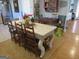 Dining room with large table, wooden chairs, stainless steel refrigerator, and hardwood flooring at 526 Mount Carmel Church Rd, Temple, GA 30179