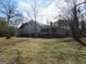 Back exterior view of a two-story home with screened-in porch at 526 Mount Carmel Church Rd, Temple, GA 30179