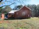 Backyard view of the home, featuring well water and a shed at 526 Mount Carmel Church Rd, Temple, GA 30179
