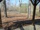 Image shows the view from an old gazebo overlooking a lush pond at 526 Mount Carmel Church Rd, Temple, GA 30179