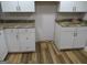 A kitchen featuring white cabinets, dark hardware, and granite countertops at 526 Mount Carmel Church Rd, Temple, GA 30179