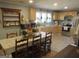 Bright kitchen featuring neutral cabinets, stainless steel appliances, and a large table at 526 Mount Carmel Church Rd, Temple, GA 30179
