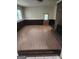 Spacious living room features a classic brick fireplace, wood-paneled walls, and generous natural light at 526 Mount Carmel Church Rd, Temple, GA 30179
