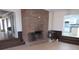 Spacious living room with a brick fireplace and an open doorway to the kitchen at 526 Mount Carmel Church Rd, Temple, GA 30179