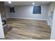 Spacious living room with modern wood-look floors and recessed lighting at 526 Mount Carmel Church Rd, Temple, GA 30179