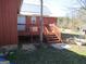 Property featuring back porch stairs, and a garden area at 526 Mount Carmel Church Rd, Temple, GA 30179