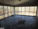 Enclosed sunroom with tile floors and large window views at 526 Mount Carmel Church Rd, Temple, GA 30179
