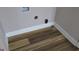 Utility room with hookups featuring modern wood-look flooring at 526 Mount Carmel Church Rd, Temple, GA 30179