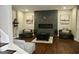 Finished basement with a fireplace feature, hardwood flooring, and cozy furniture at 116 Kalsum Trl, Ellenwood, GA 30294