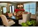 Inviting dining room featuring an elegant chandelier, large windows and comfortable seating at 116 Kalsum Trl, Ellenwood, GA 30294