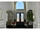 Elegant foyer with soaring ceilings, arched doorways, and ornate double doors at 116 Kalsum Trl, Ellenwood, GA 30294