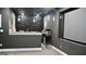 This theater room features a projector screen, popcorn machine, and wet bar for entertaining guests at 116 Kalsum Trl, Ellenwood, GA 30294