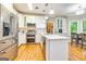 Spacious kitchen with stainless steel appliances, white cabinets, and a center island with marble countertops at 120 Majesty Ln, Fayetteville, GA 30215